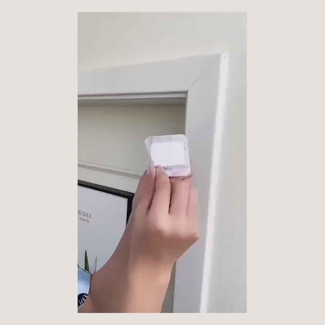 Demonstration: no-drill curtain rod bracket stuck to a door frame and a curtain hung from it